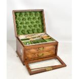 A Victorian walnut jewellery casket with hinged lid set with recessed carrying handle, fall-front