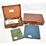 Two small leather briefcases, one containing set of Minibrix and two travelling stationery sets (
