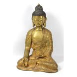 A 19th century gilt bronze Shakyamuni seated Buddha with apocryphal four character Qianlong mark