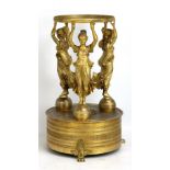 A late 19th century gilt metal centre piece modelled as the three female figures holding aloft a