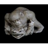A Japanese Meiji period okimono of a monkey wrestling a toad, length 5cm.Additional