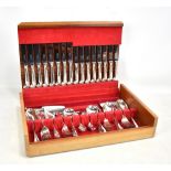 A teak cased eight setting canteen of plated cutlery by George Butler of Sheffield.