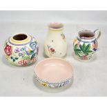 POOLE; four pieces of floral decorated pottery.