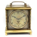 SMITHS; a brass cased mantel/desk clock, the circular dial set with Arabic numerals, manufacturer'