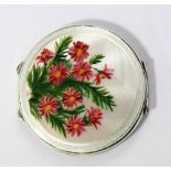 A George VI hallmarked silver and enamel decorated circular compact, Birmingham 1948, diameter 7cm.