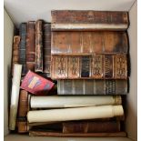 A group of leather bound books.