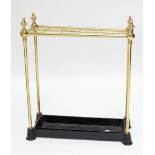 A brass twelve division stick/umbrella stand with cast iron base and tray, height 61cm. Additional