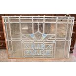 A vintage leaded stained glass panel 'Bar, Parlour' (af), width 100cm.