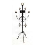 A modern wrought iron candle holder with a group of polished silvered balls, height 203cm.
