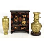 A 20th century Japanese table top jewellery cabinet with painted and gilt detail of birds amongst