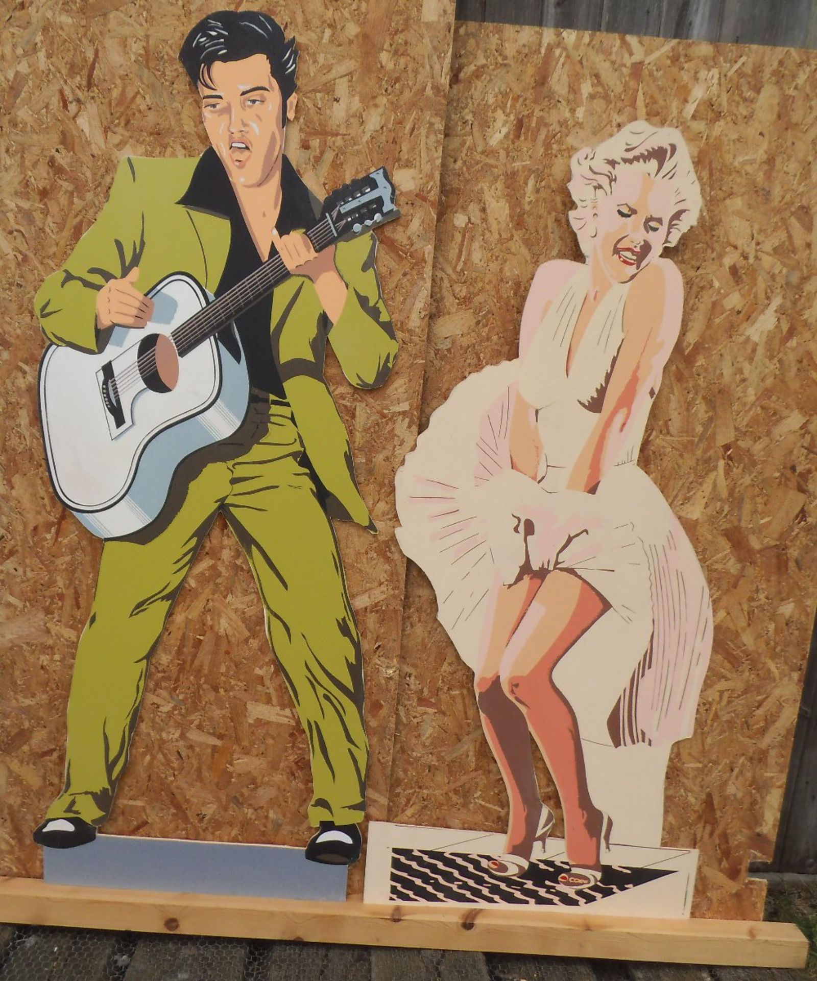 Life size wooden cut outs of Elvis Presley and Marilyn Monroe, height, 188 & 173cm.