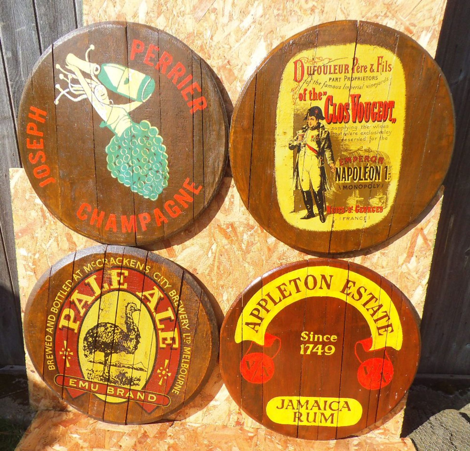 Four various reproduction oak barrel lids, diameter 60cm.