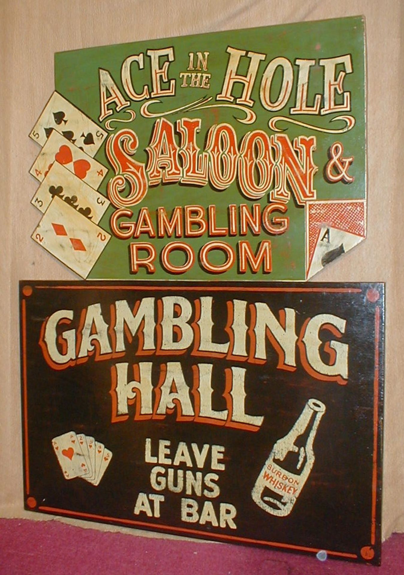 Ace in the Hole Saloon and Gambling Hall American West wooden signs, 81 x 55cm and 74 x 56cm.