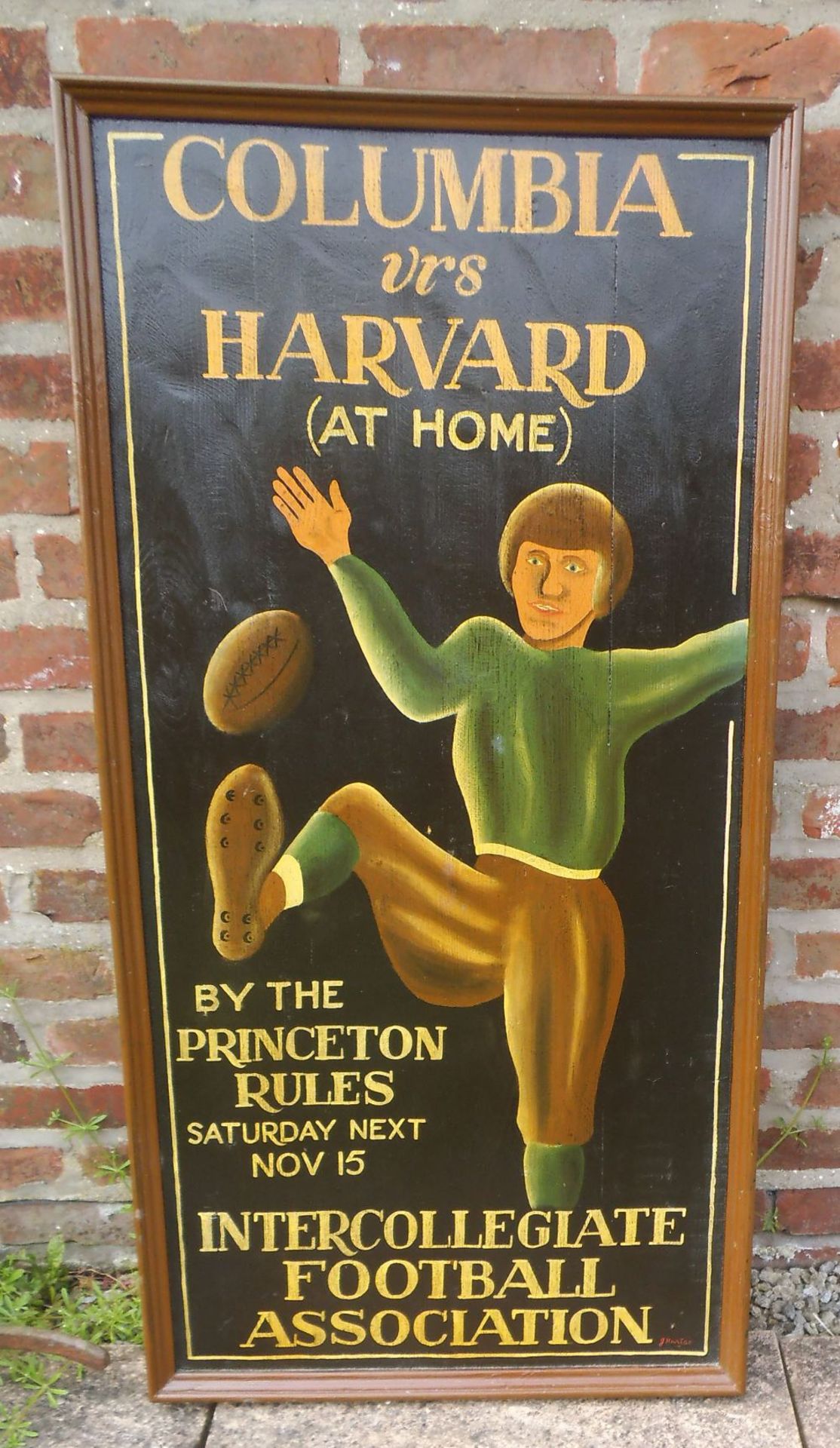 A reproduction wooden American football sign, height 120cm.