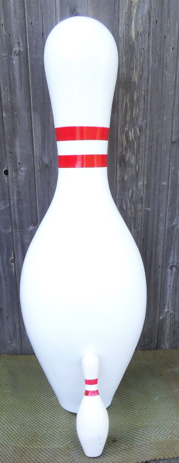 A giant fibreglass 10 pin skittle, height 150cm.