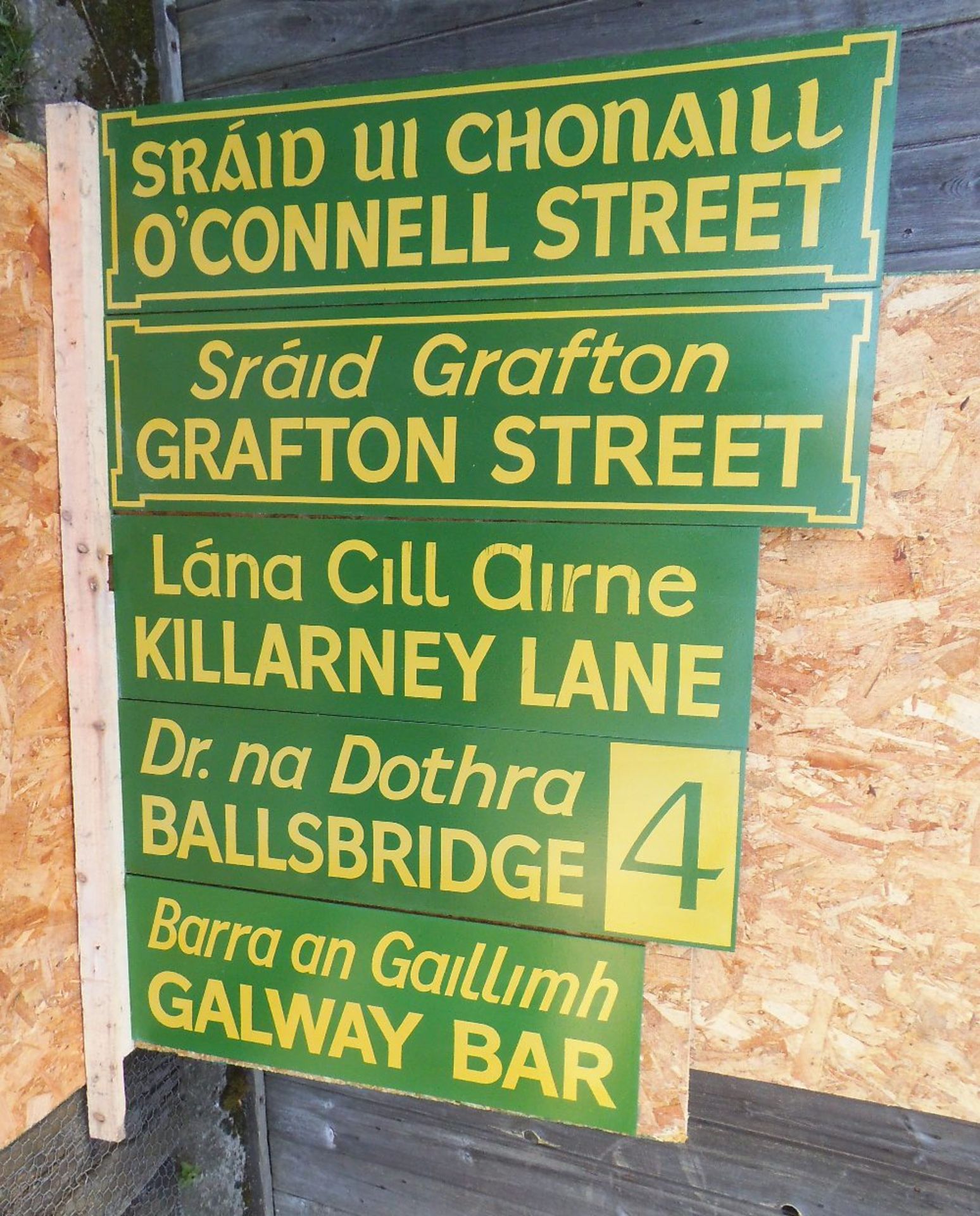 Five reproduction Irish street signs, width 92cm.