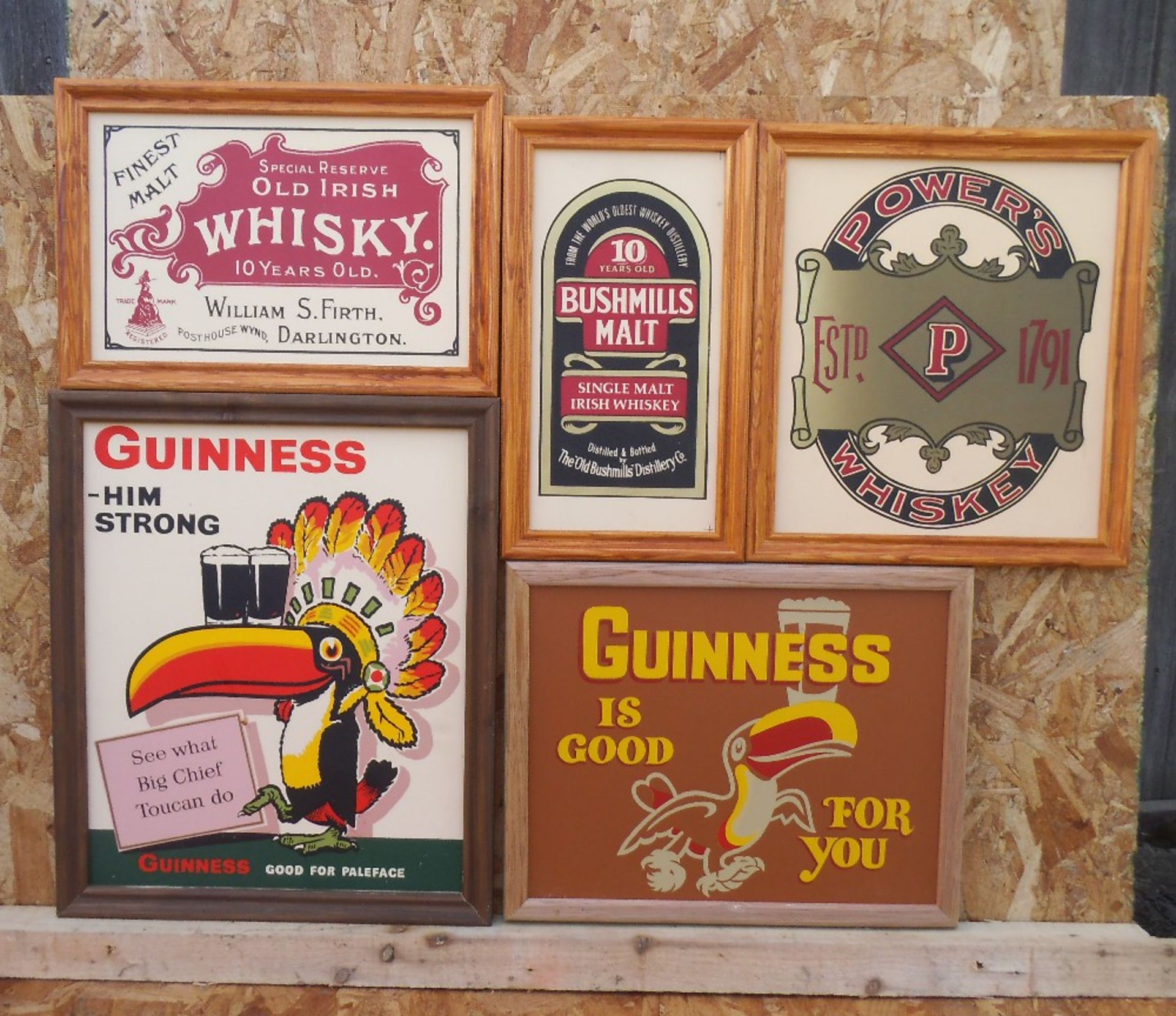 Five framed reproduction advertising whisky and Guinness signs, “G is good for you” 43cm wide.