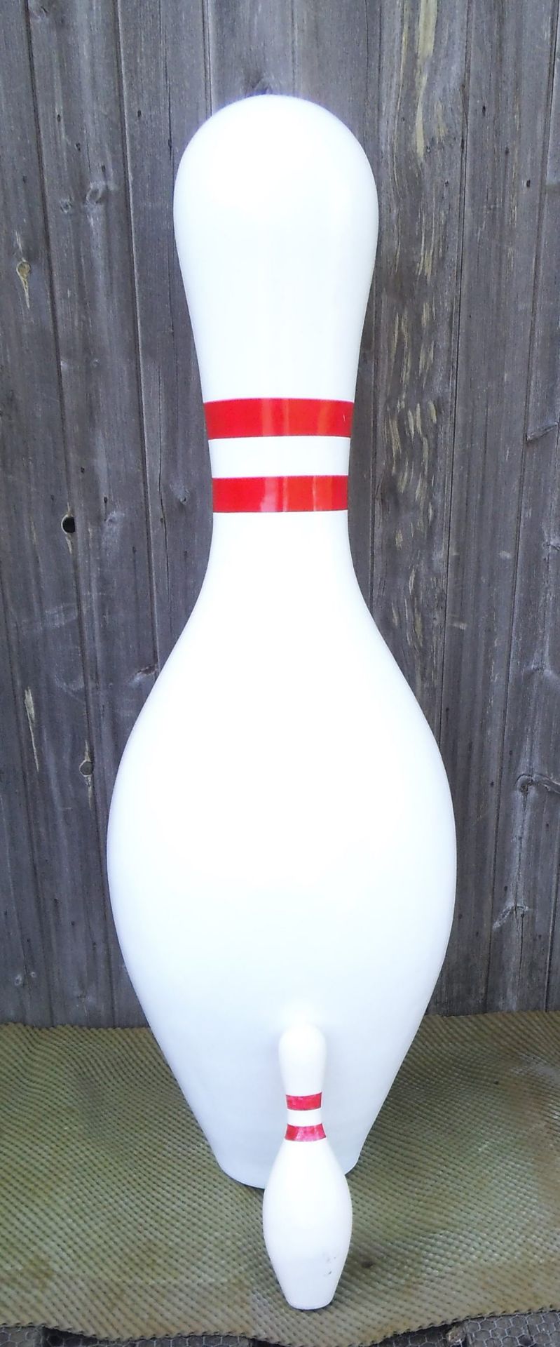 A giant fibreglass 10 pin skittle, height 150cm.