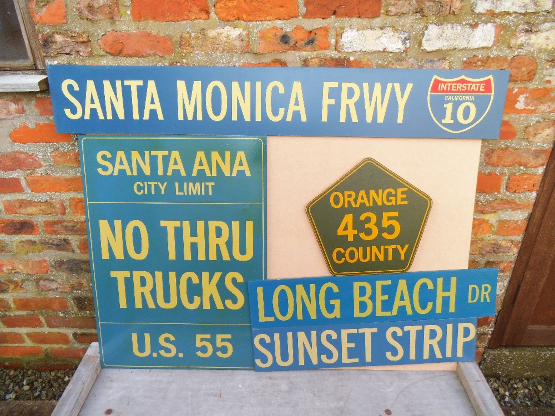 Five reproduction wooden signs, Santa Ana width 61cm.