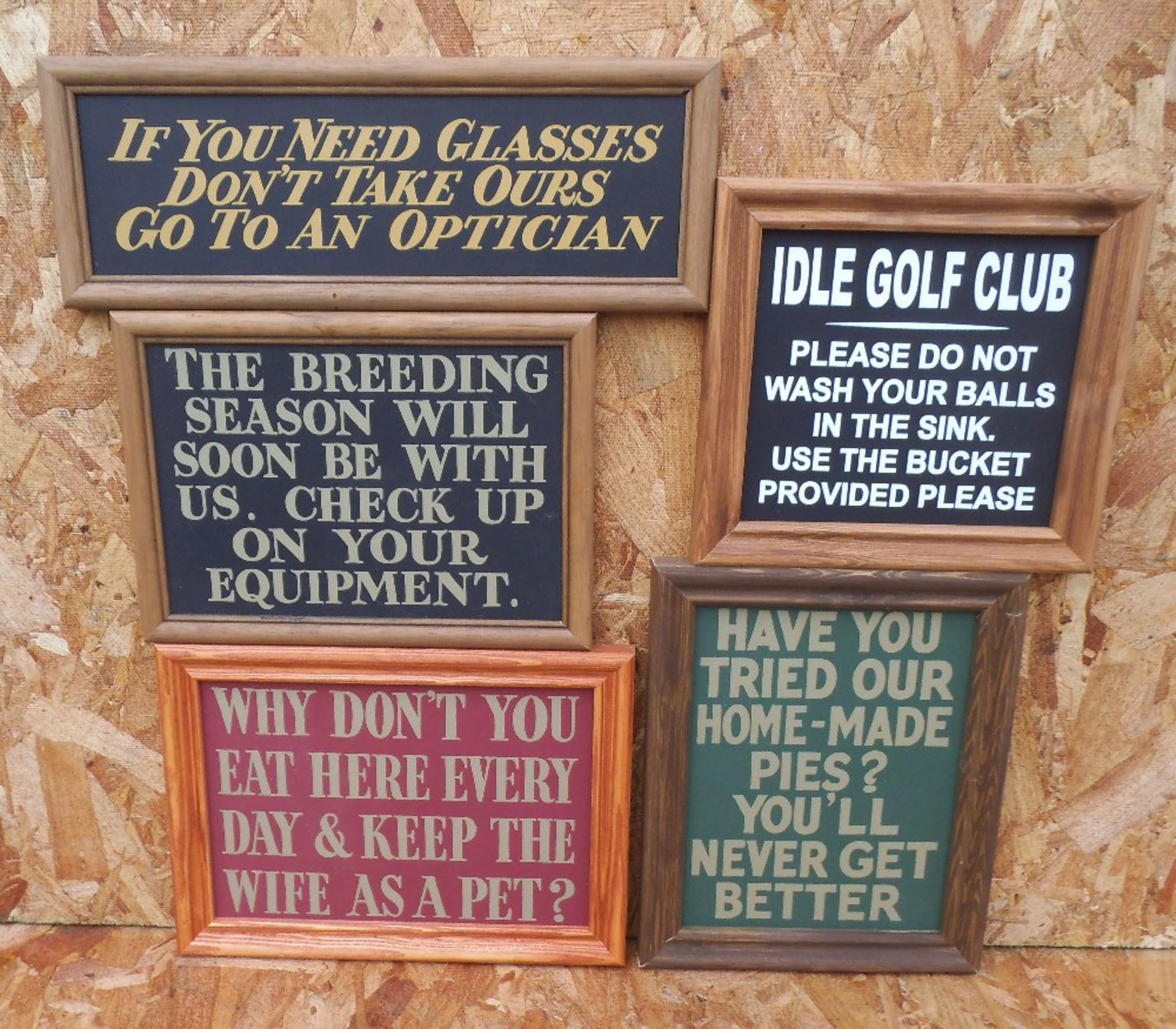 Five humorous wooden bar signs, framed, “breeding season” width 30cm.