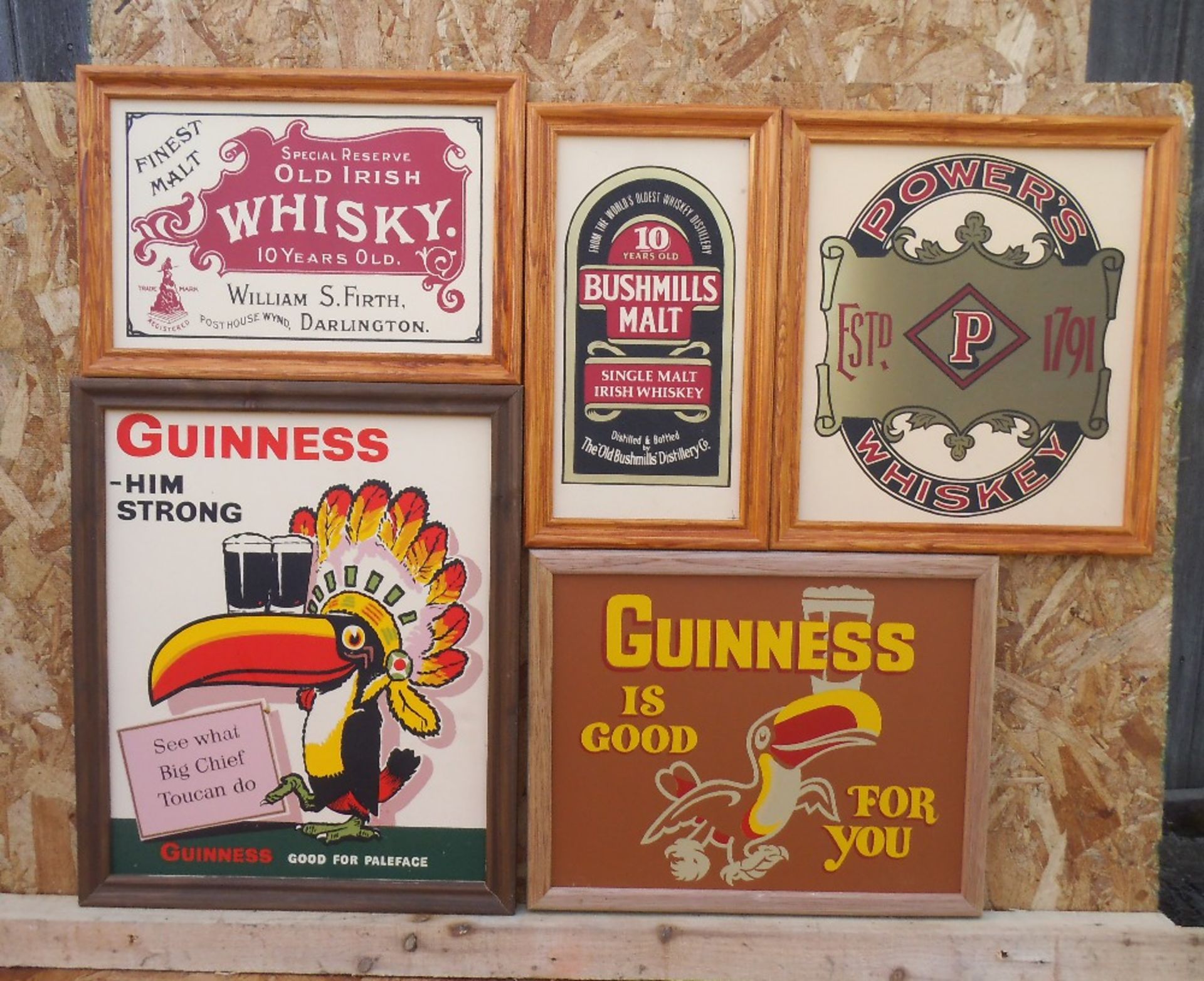 Five framed reproduction advertising whisky and Guinness signs, “G is good for you” 43cm wide.