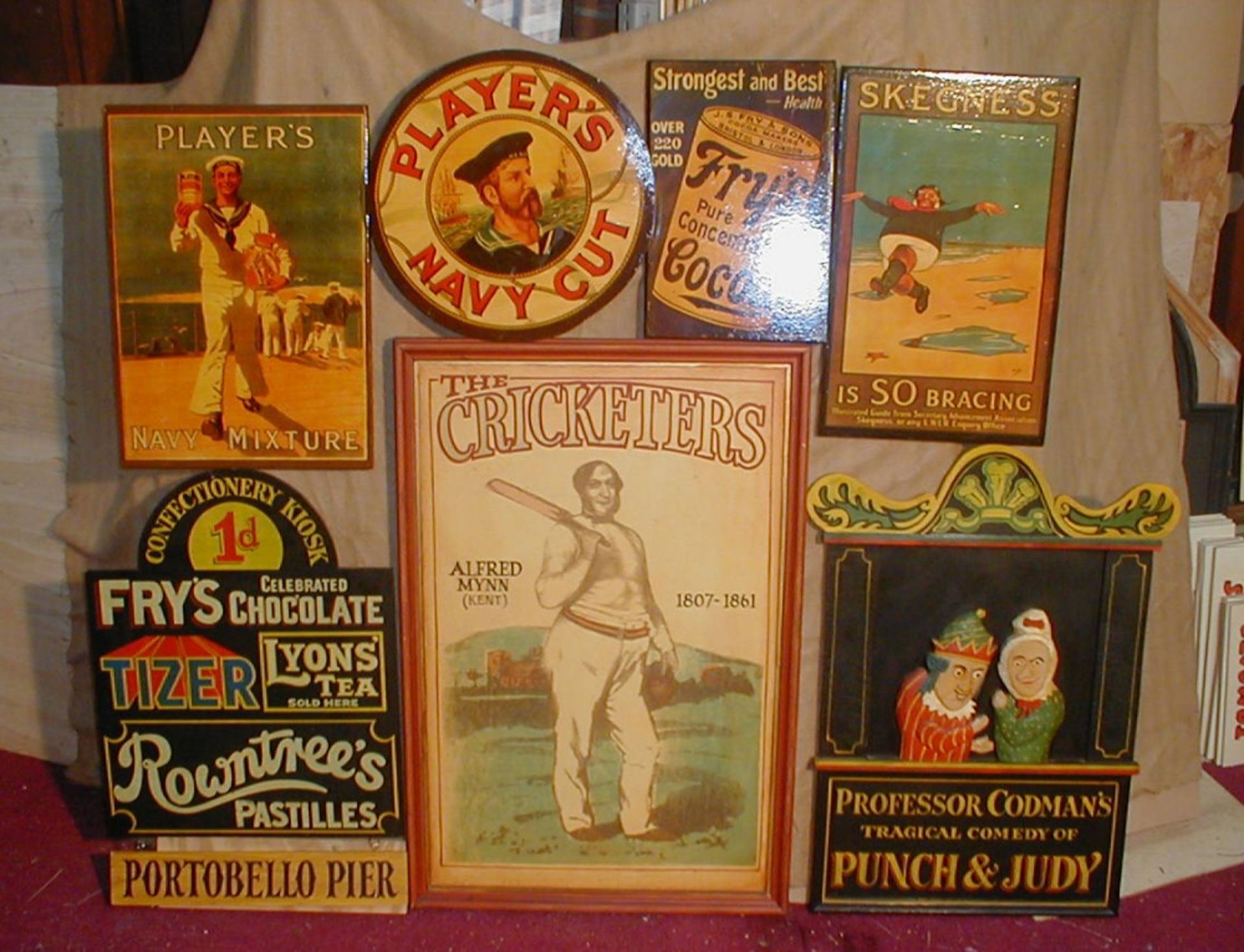 Seven wooden reproduction English old fashioned signs. Size guide ‘Punch and Judy’ 57 x 78cm.