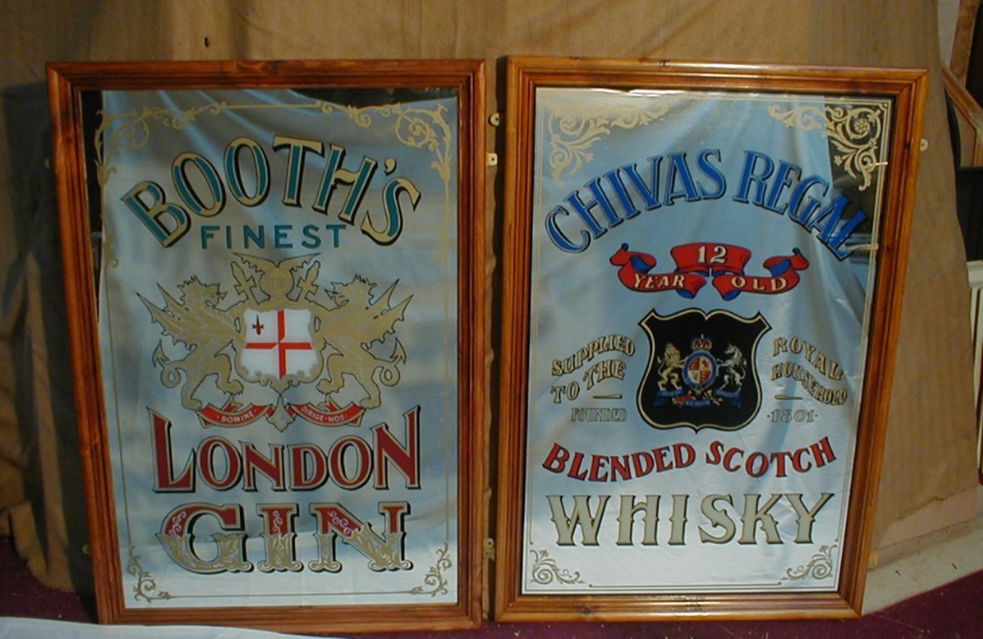 Two reproduction pub mirrors advertising Booths Gin and Chivas Regal Whisky, each approx length