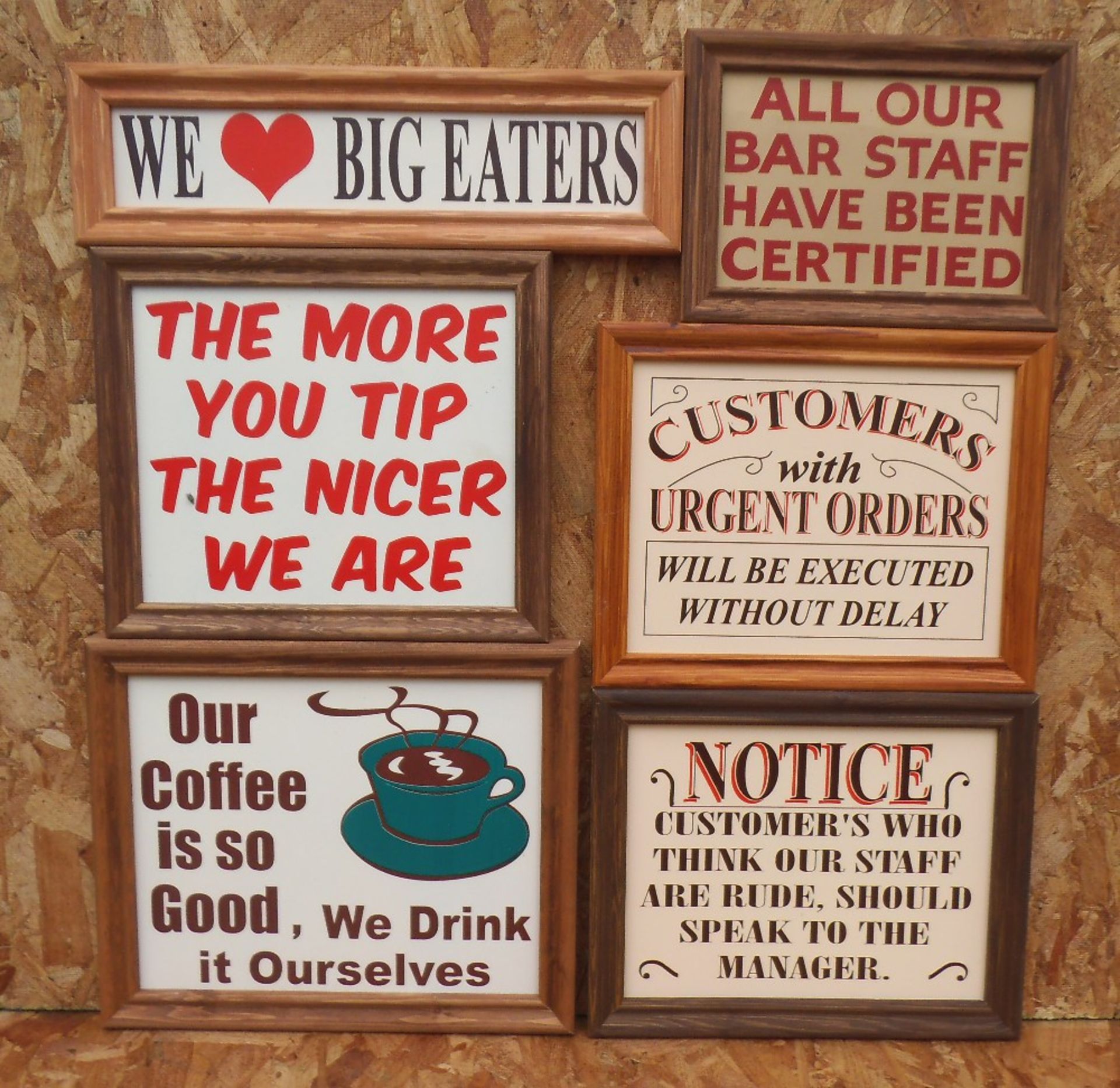 Six humorous wooden bar signs, framed, “staff are rude” width 35cm.