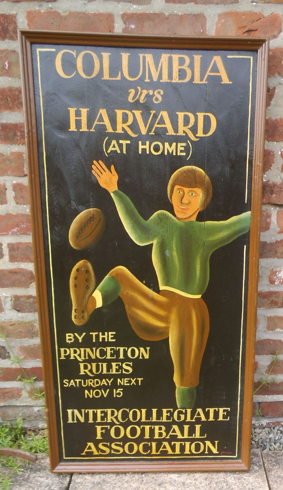 A reproduction wooden American football sign, height 120cm.