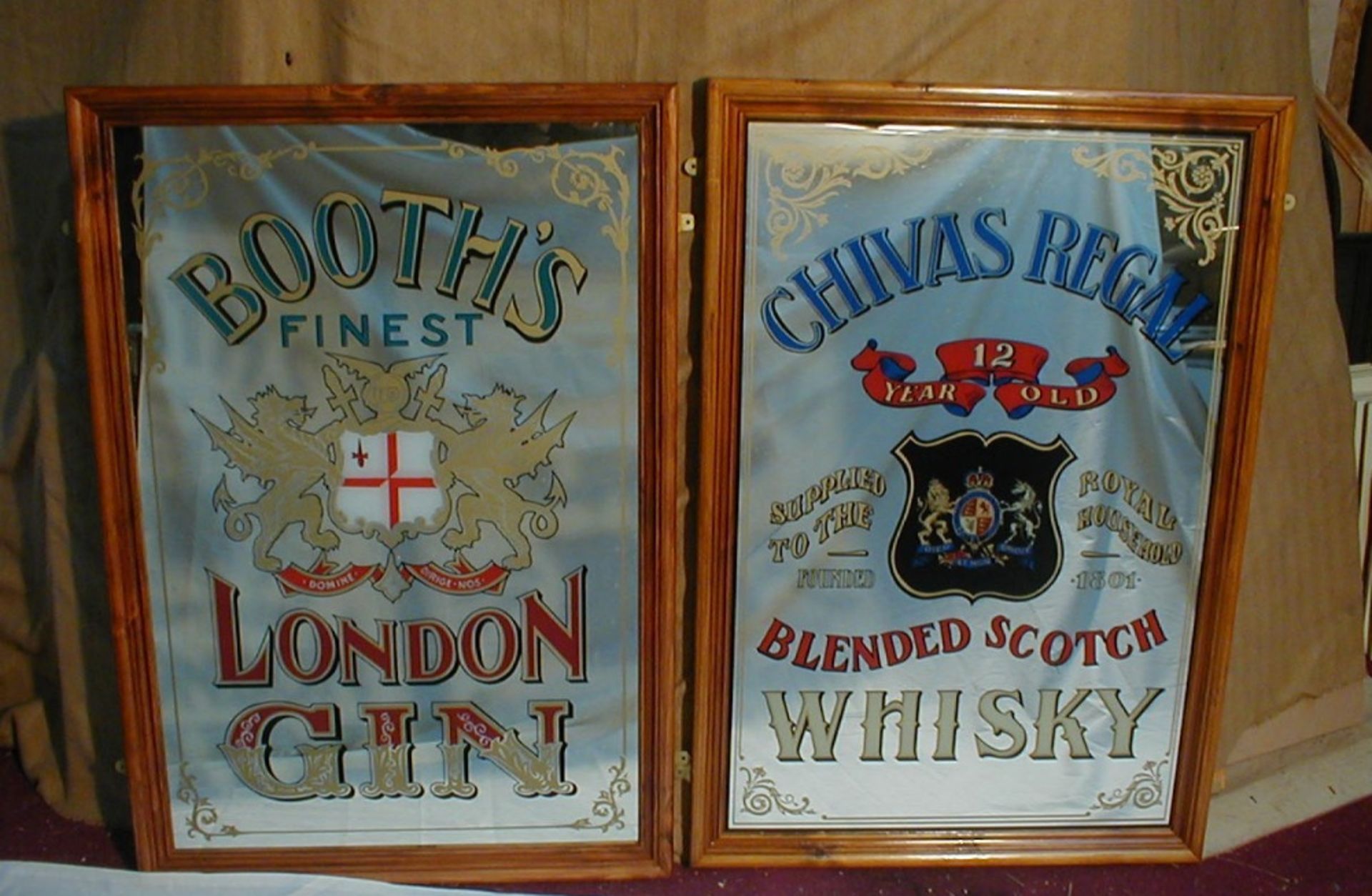 Two reproduction pub mirrors advertising Booths Gin and Chivas Regal Whisky, each approx length