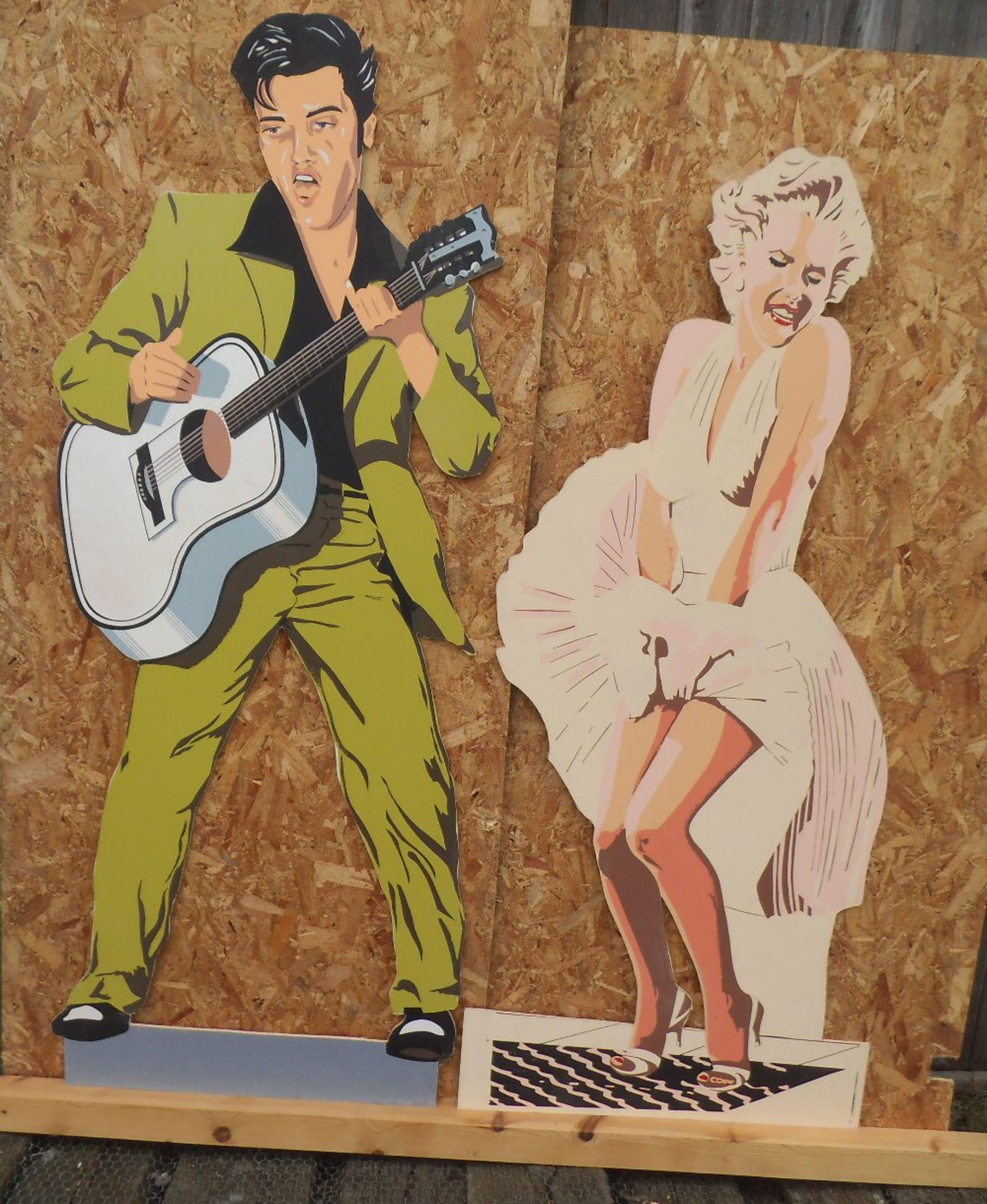 Life size wooden cut outs of Elvis Presley and Marilyn Monroe, height, 188 & 173cm.