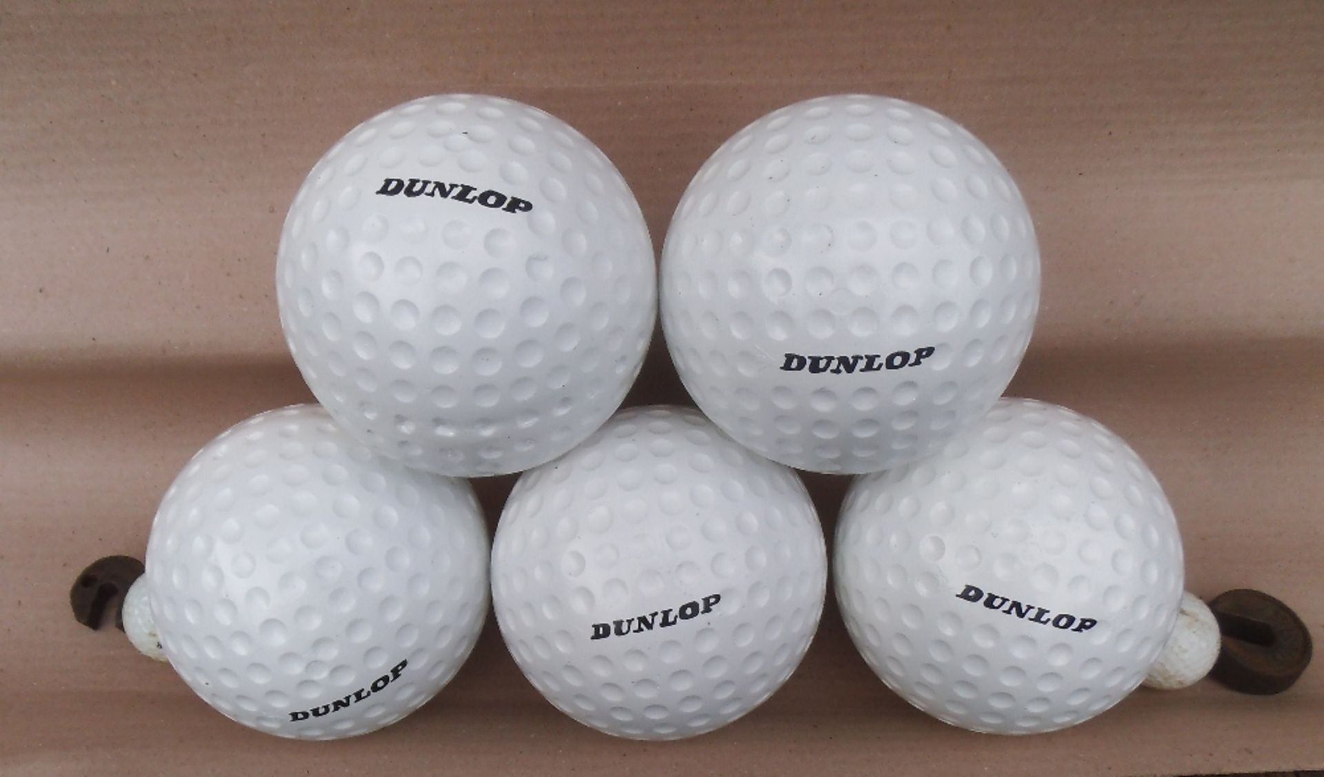 Five large fibreglass resin golf balls, diameter 13cm.