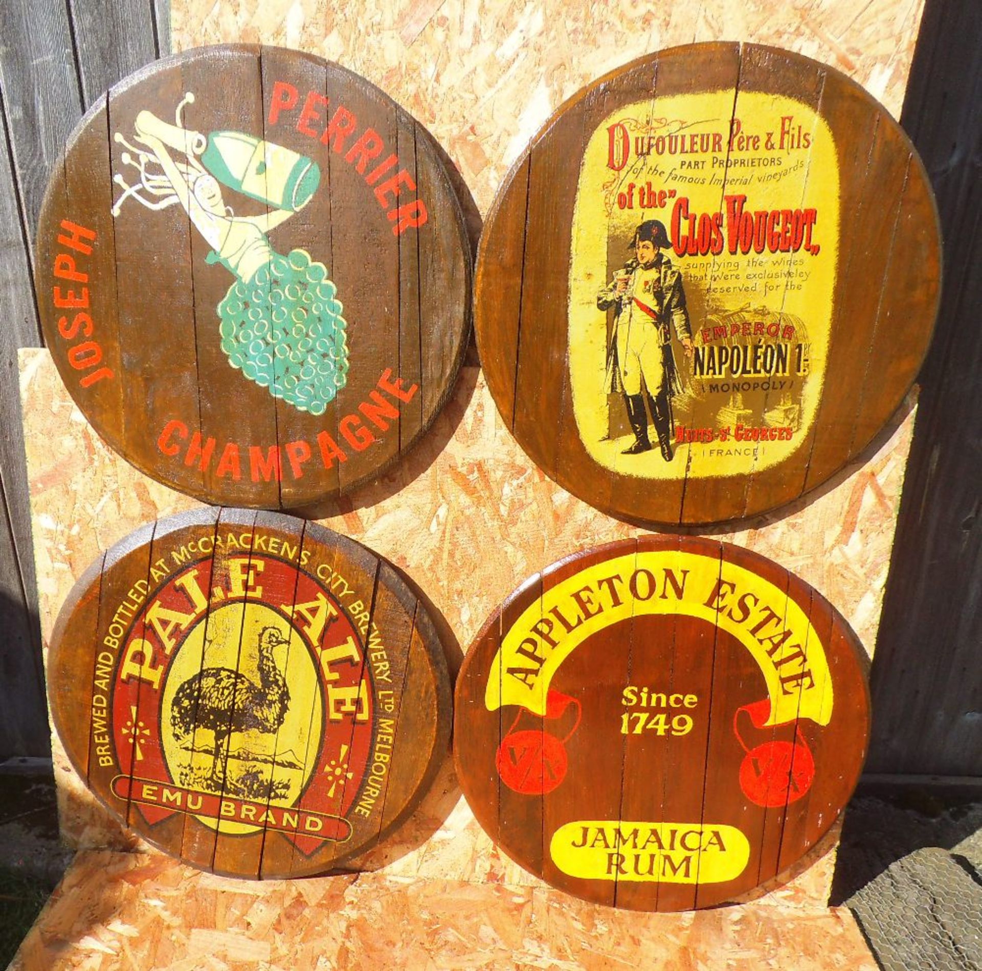 Four various reproduction oak barrel lids, diameter 60cm.