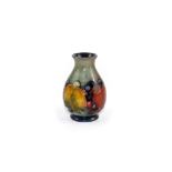 A Moorcroft squat baluster vase, tube-lined decoration of grape and leaf,