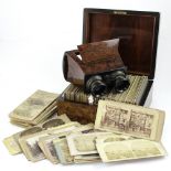 A collection of card stereo viewer slides presented in Victorian red walnut box and an early 20th