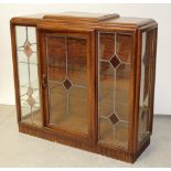 A c1950s oak Art Deco style display cabinet,