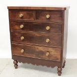 A Victorian mahogany rounded-corner chest of two-over-three drawers with shaped apron and turned