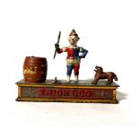 An original late 19th century novelty cast iron money bank, 'Trick Dog', stamped to base, 'Pat.