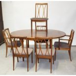 A c1970s G-plan teak circular extending dining table, length when extended approx 170cm,