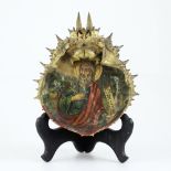 A 19th century Greek icon painted to the inside of a spider crab shell,