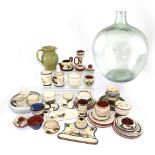 A quantity of tourist ware to include Dartmouth and Torquay pottery examples, cups, saucers,