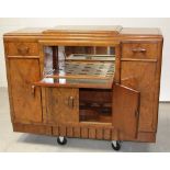 A c1950s Art Deco style mahogany sideboard/cocktail cabinet,