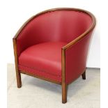 A restored Edwardian mahogany-framed tub chair, re-upholstered in red leather-look fabric.