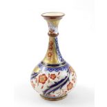 A MacIntyre Aurelian vase by William Moorcroft c1898 with stylised red floral design to a