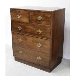 An early 20th century oak two-over-three chest of drawers, on plinth supports,