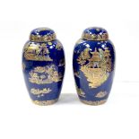 A pair of modern Carltonware blue ground ginger jars with lids, in the Pagoda pattern,