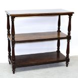 A late Victorian mahogany buffet with three shelves, on turned supports and turned feet,