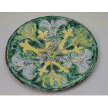 A Della Robbia style plate signed Jane Farbar 1995 to base, diameter 24cm.