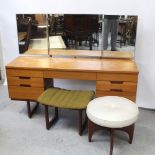 A mid-20th century Uniflex triple mirror-back kneehole dressing table,