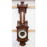 A late 19th/early 20th century oak barometer,